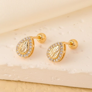 Macro shot of gold teardrop earrings with pave set white zircon and screw ball backs