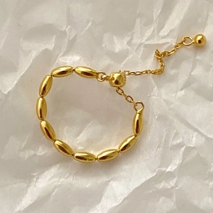 Detail of adjustable S925 sterling silver gold beaded ring with small round pendant