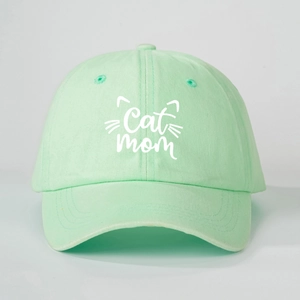Close-up of Cat Mom embroidery and cat ears design on mint green cotton baseball cap