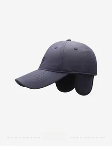 Detail view of winter baseball cap with thick ear flaps and waterproof fabric