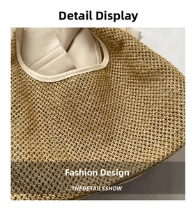 Detailed close-up of the beige hand-woven straw texture and cotton lining on the tote bag