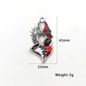 Gothic heart pendant with angel and demon wings in vintage silver and red enamel