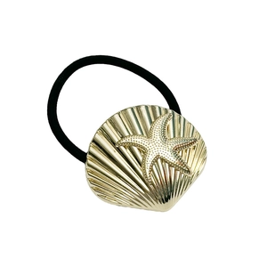 Golden shell and starfish hair tie with black elastic band for minimalist ponytail style