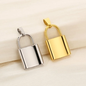 Polished gold and silver padlock pendants on textured fabric for DIY jewelry making