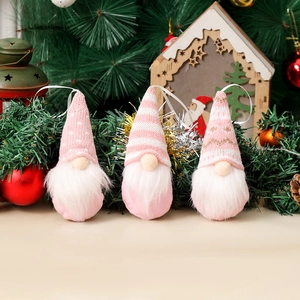 Set of three pink knitted Christmas gnome ornaments for tree decorations and holiday gifts
