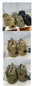 Detail of high-density canvas backpack with drawstring closure and side handle