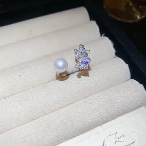 Silver adjustable ring with bow-knot cubic zirconia and pearl on jewelry box