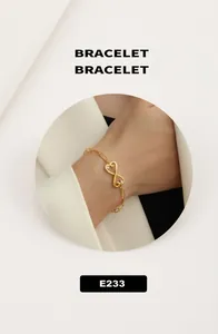 Detail of 18K gold-plated infinity bracelet with zircon stones on model's wrist