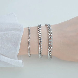 Silver cuban chain bracelet for men and women in three widths on model wrist
