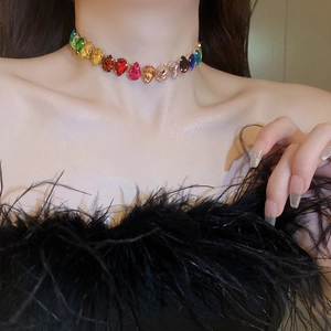 Detailed close-up of teardrop-shaped rainbow crystal choker necklace with multi-color gems