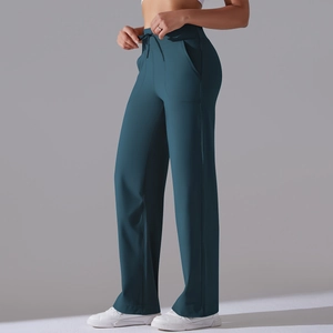 Close-up of high-waisted wide-leg yoga pants featuring drawstring waist and side pockets