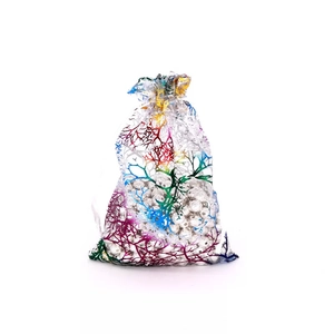 Detail of organza drawstring gift bag with iridescent coral branch metallic print texture