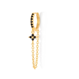 Detail of gold floral earrings with black crystals and dangling chain tassel