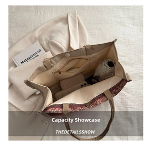 Detailed interior view of a large linen tote bag showing zipper pocket and spacious storage