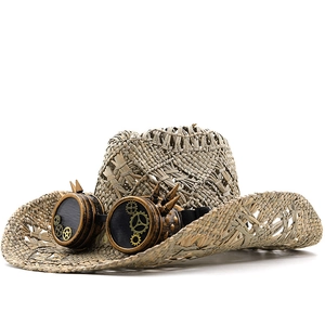 Detail of woven straw cowboy hat featuring vintage steampunk goggles and gear accents
