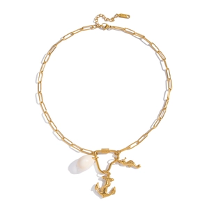 Detail of 18K gold clip chain necklace with shell, anchor and seahorse charms