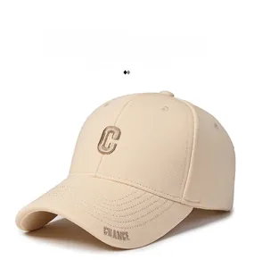 Detail of light beige baseball cap with 3D brown C embroidery and CHANCE brim text