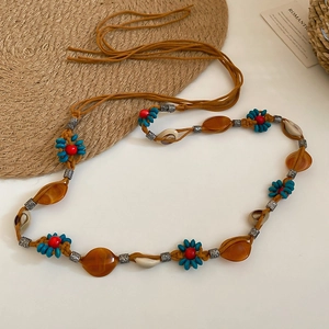 Handmade woven waist chain with turquoise resin flowers and shells in ethnic style