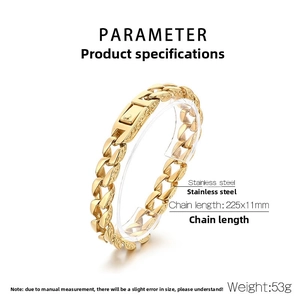 Macro shot of 11mm gold Cuban link bracelet with engraved texture and steel clasp
