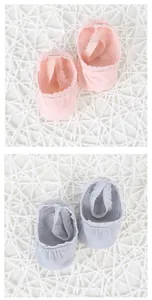 Detail of baby lace princess socks in pink and gray cotton with elastic straps