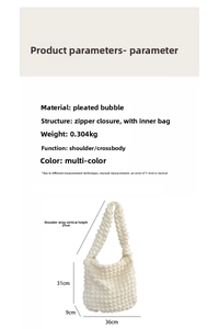 Detail view of large white bubble textured tote bag with zipper closure and strap dimensions