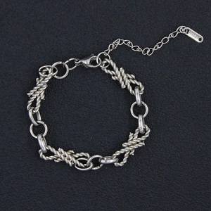 Detail of silver stainless steel chain with lobster clasp and KTS brand tag