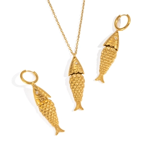Golden fish jewelry set with necklace and earrings featuring sparkling stone eyes
