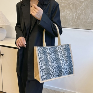 Stylish large leopard print tote bag with jute trim and comfortable canvas shoulder handles