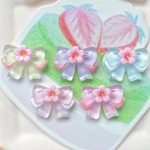Colorful resin flower bow charms for hair clips and DIY crafts in five pastel colors