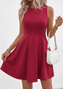 Detail showing the waistline and pleated hem of a dark red sleeveless A-line summer dress