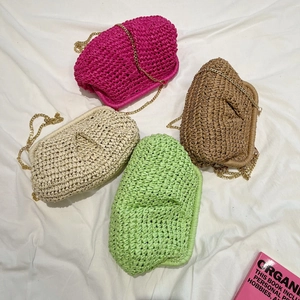 Colorful woven clutch bags in candy tones with gold metal chain shoulder straps