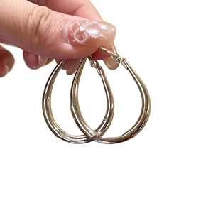 Minimalist silver teardrop hoop earrings for women with elegant metallic finish