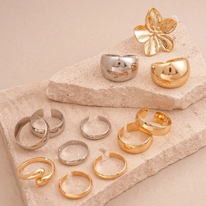 Three-piece geometric metal ring set with smooth gold and silver flower open rings