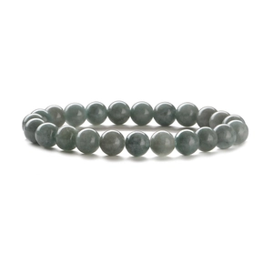 Macro detail of natural light green imperial jasper beads with smooth stone texture