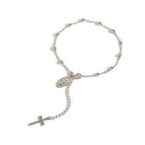 Religious style rosary cross bracelet with silver beads and oval medal on white background