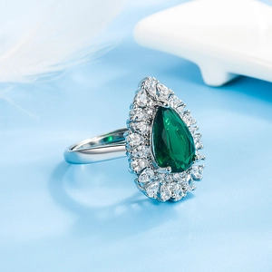 Elegant pear-cut emerald ring with micro-pave cubic zirconia in silver metal finish