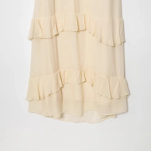 Fashionable cream yellow layered midi dress featuring elegant tiered ruffle details