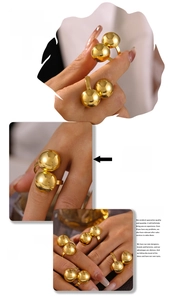 Multiple views of a chunky 18k gold plated double ball open ring on a model