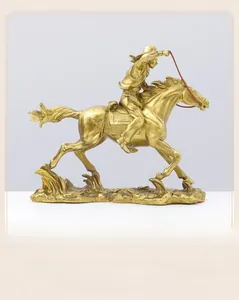 Detailed close-up of a bronze Western cowboy horse rider sculpture with intricate metal texture