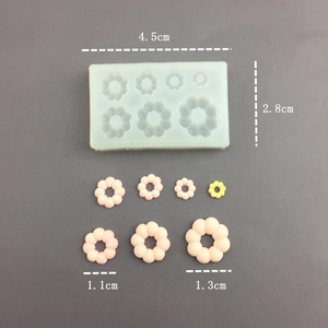 Detailed view of flower donut silicone mold with dimensions and resin finished samples