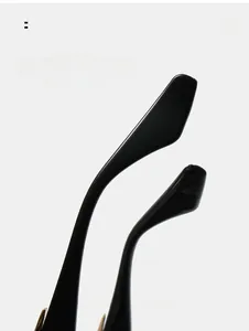 Detail of ergonomic curved black glossy temple arms for stylish cat-eye sunglasses