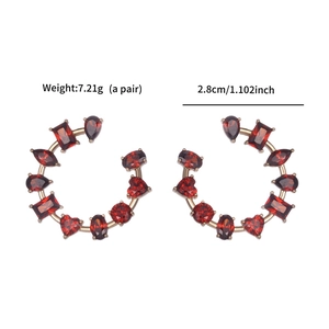 Detail view of red zircon earrings in gold finish showing dimensions 2.8cm and weight 7.21g