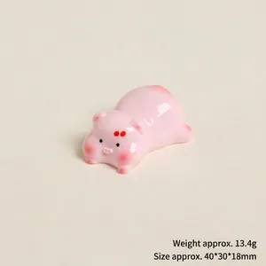 Detail view of mini resin pink pig figurine showing 40x30x18mm size and 13.4g weight