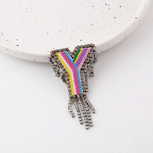 Rainbow letter Y brooch with colorful stripes, crystals, and long dangling tassels