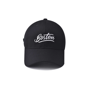 Close-up of white Boston embroidery on black cotton baseball cap with premium texture