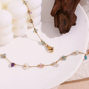 Detail of 18K gold-plated chain with natural crushed gemstones and lobster clasp