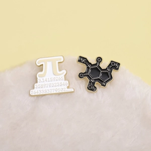 Creative enamel pins set featuring mathematical Pi and Caffeine molecule designs