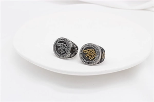 Macro shot of vintage Viking wolf head rings with engraved runic symbols for men