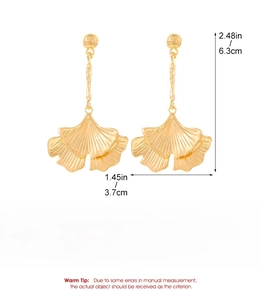 Detailed view of gold ginkgo leaf earrings with dimensions 6.3cm by 3.7cm