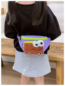 Toddler wearing a cute purple cartoon bus waist bag with large eyes on a wooden bench